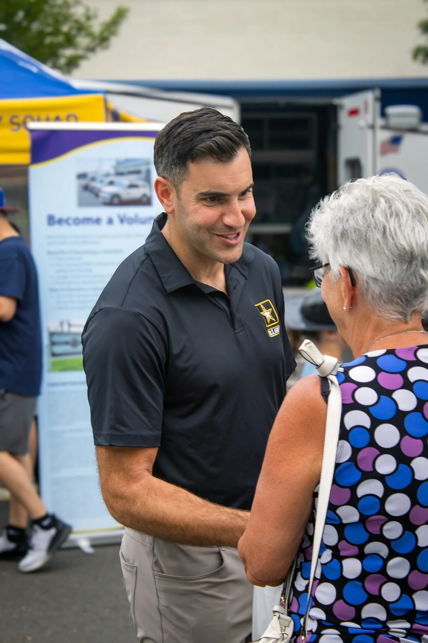 Sheriff Ceisler talking with a resident at a community event