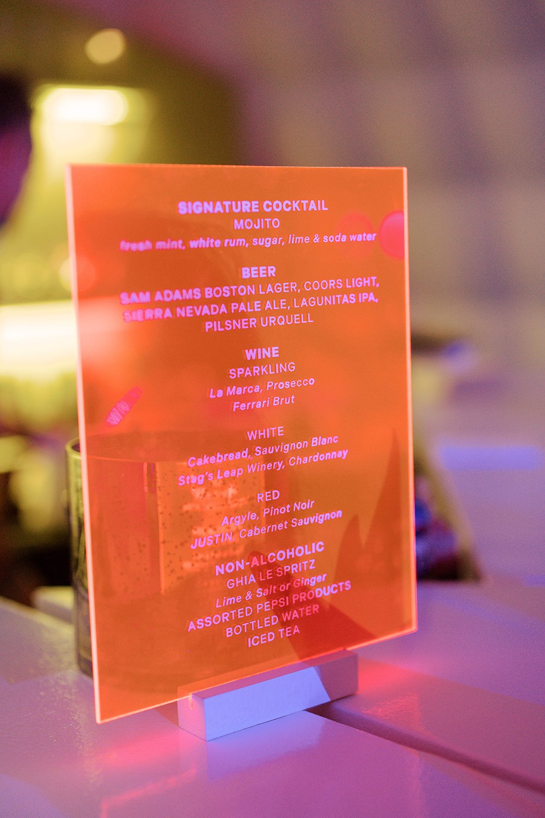 Orange acrylic signature cocktail and drinks menu