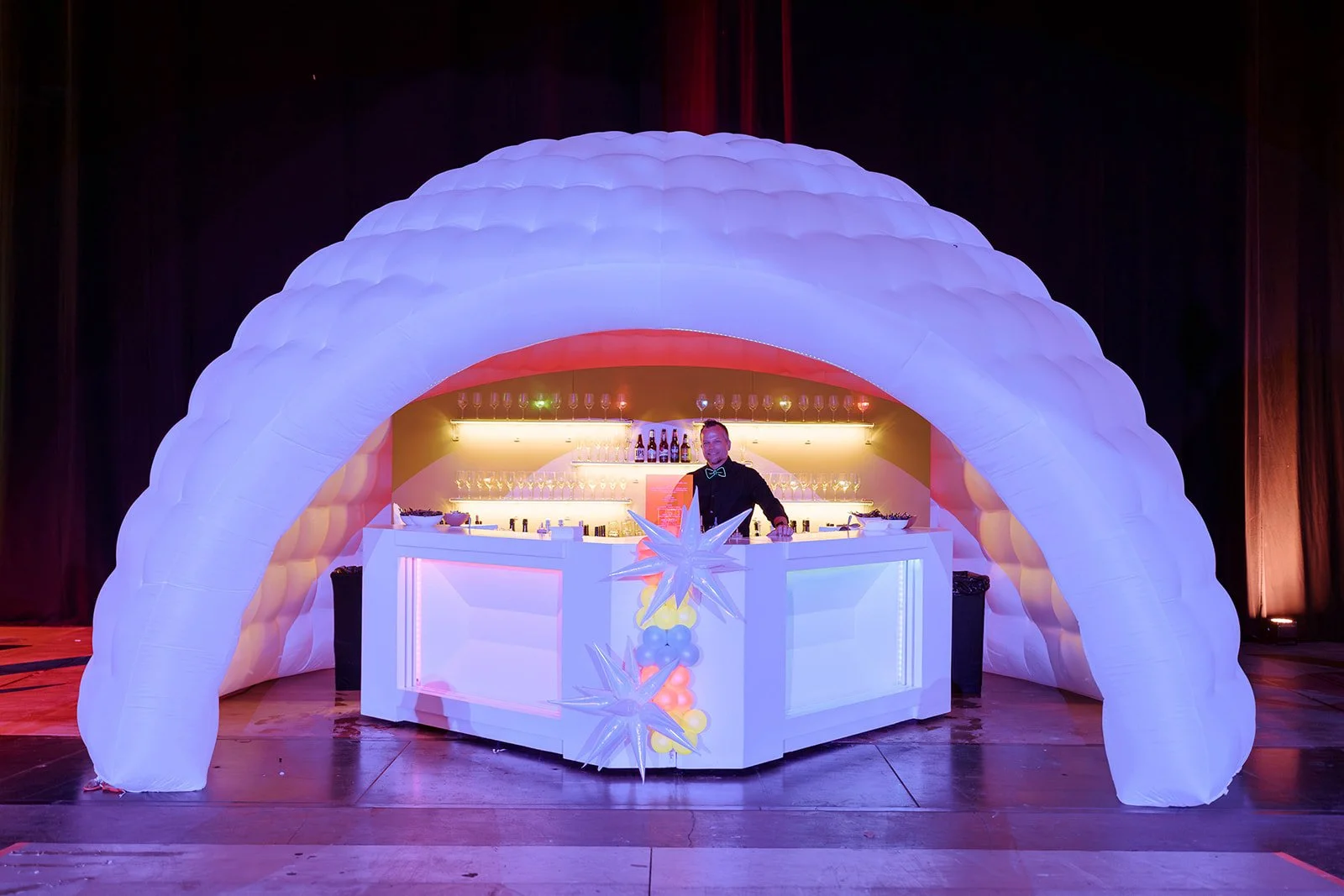 Illuminated bar beneath a sculptural inflatable canopy