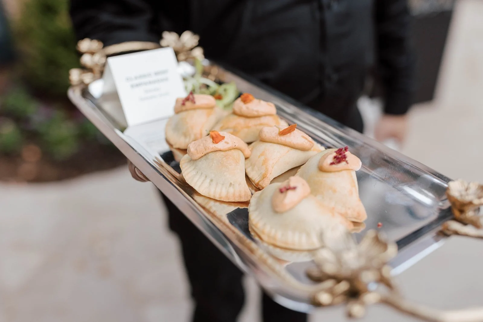 Passed appetizers on an ornate silver tray