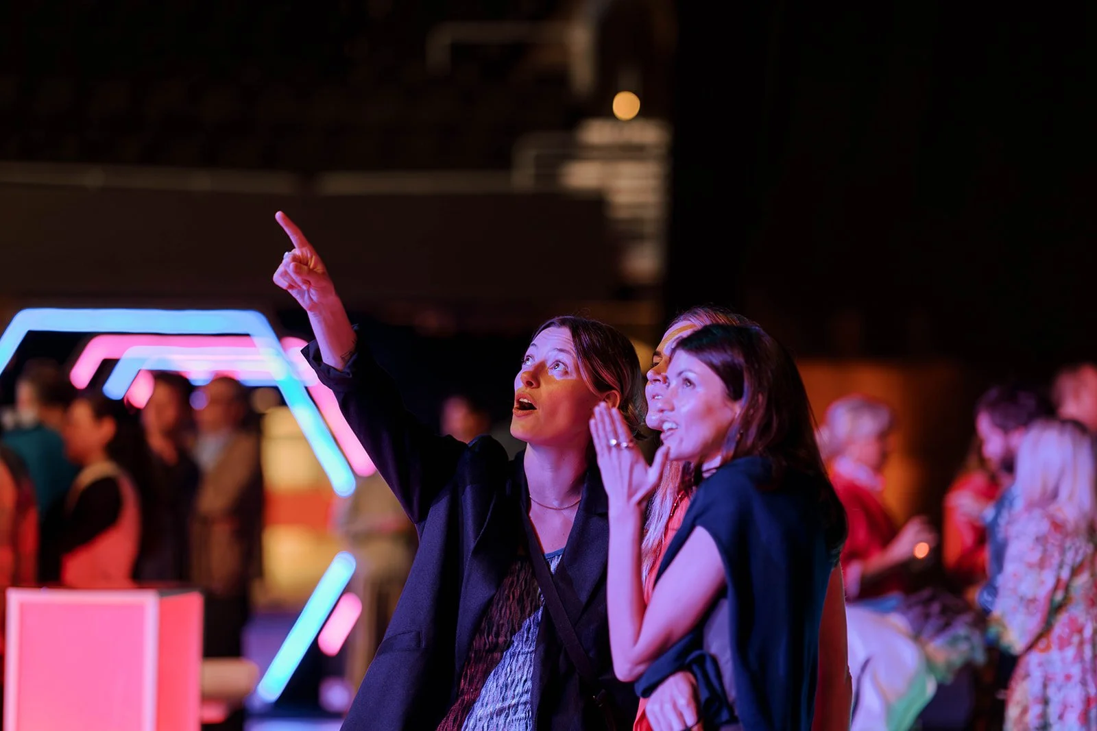 Guests enjoying the illuminated corporate celebration