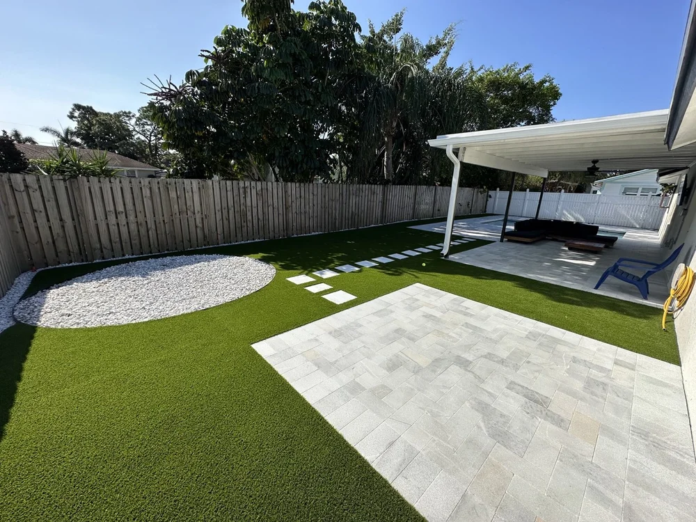 Pool surrounded by bright artificial turf