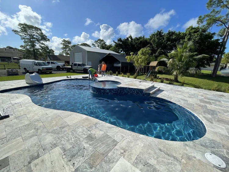 Pool and deck project by Oasis Pools and Pavers, Palm Beach County