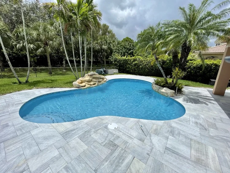 Pool and deck project by Oasis Pools and Pavers, Palm Beach County