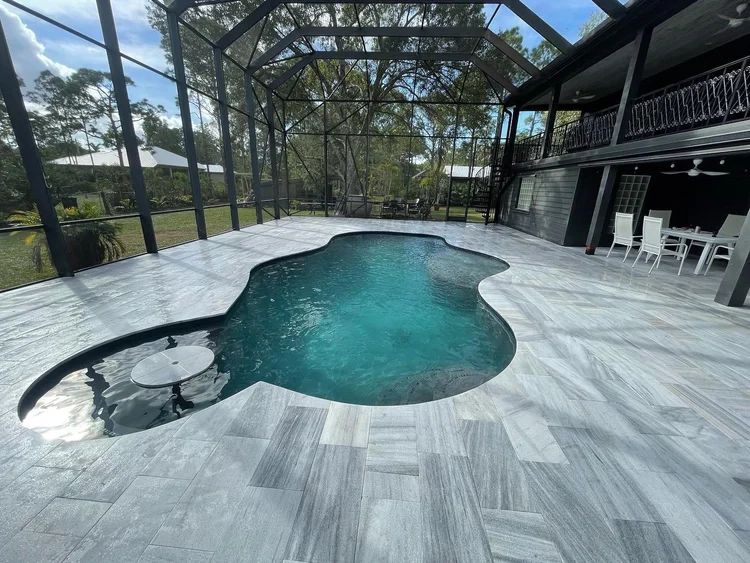 Pool and deck project by Oasis Pools and Pavers, Palm Beach County