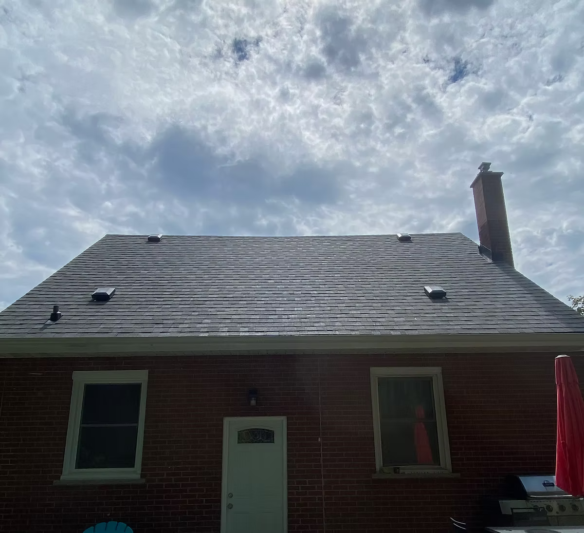 Re-shingled roof on a brick home