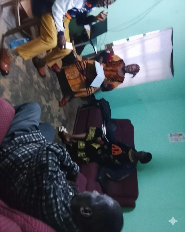 Mental health programme participants in Cameroon discussing a lesson together
