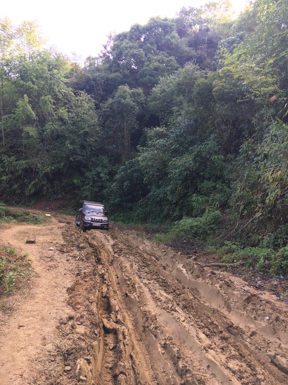 A vehicle negotiating the steep muddy road to Lalong in Nagaland