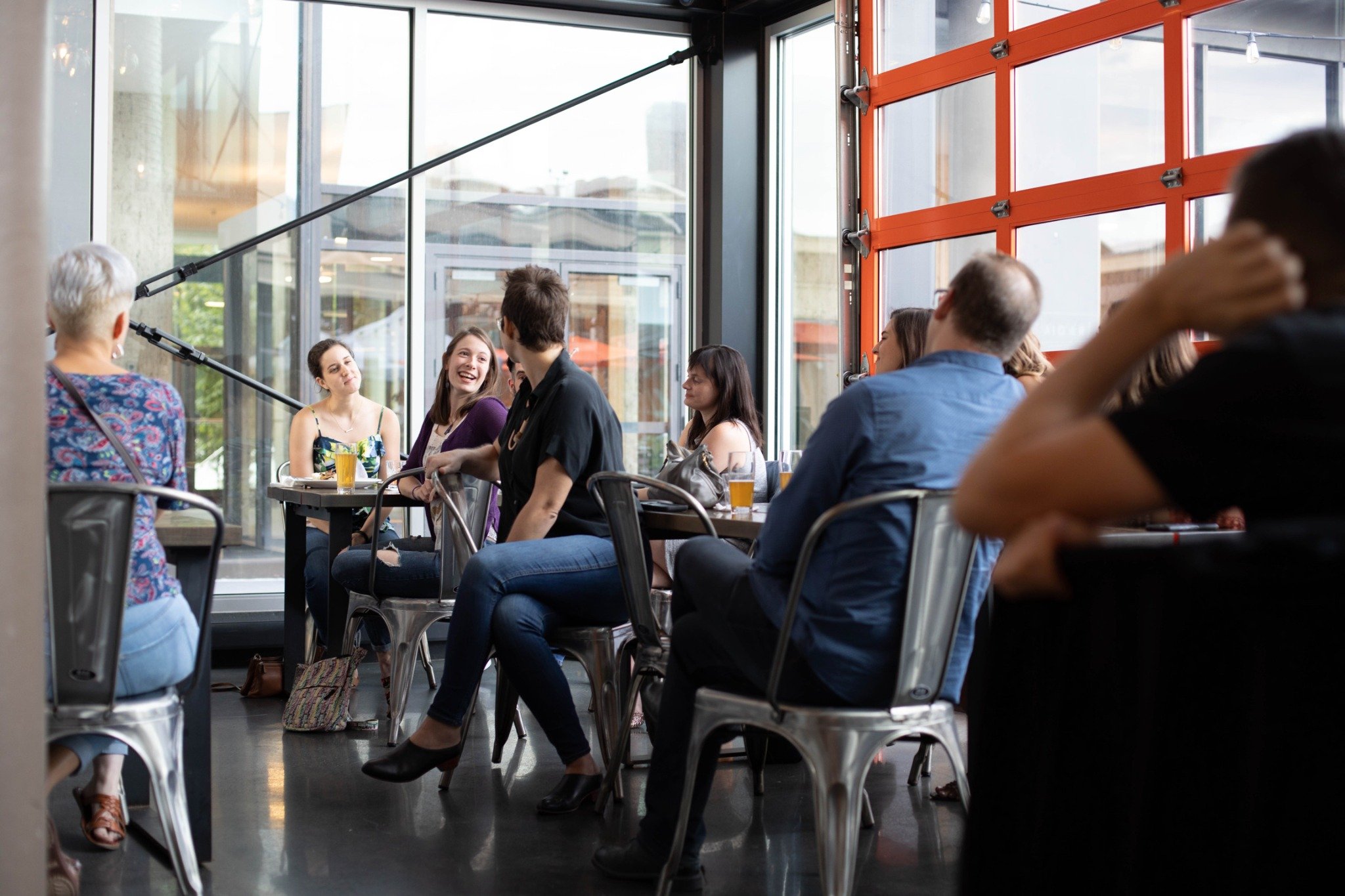 Participants sharing a conversation at an in-person gathering facilitated by Megan Sicheri.