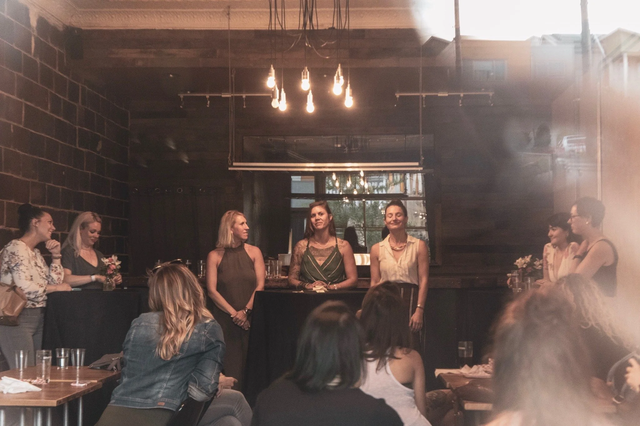 Megan Sicheri facilitating a conversation with women at an in-person gathering.