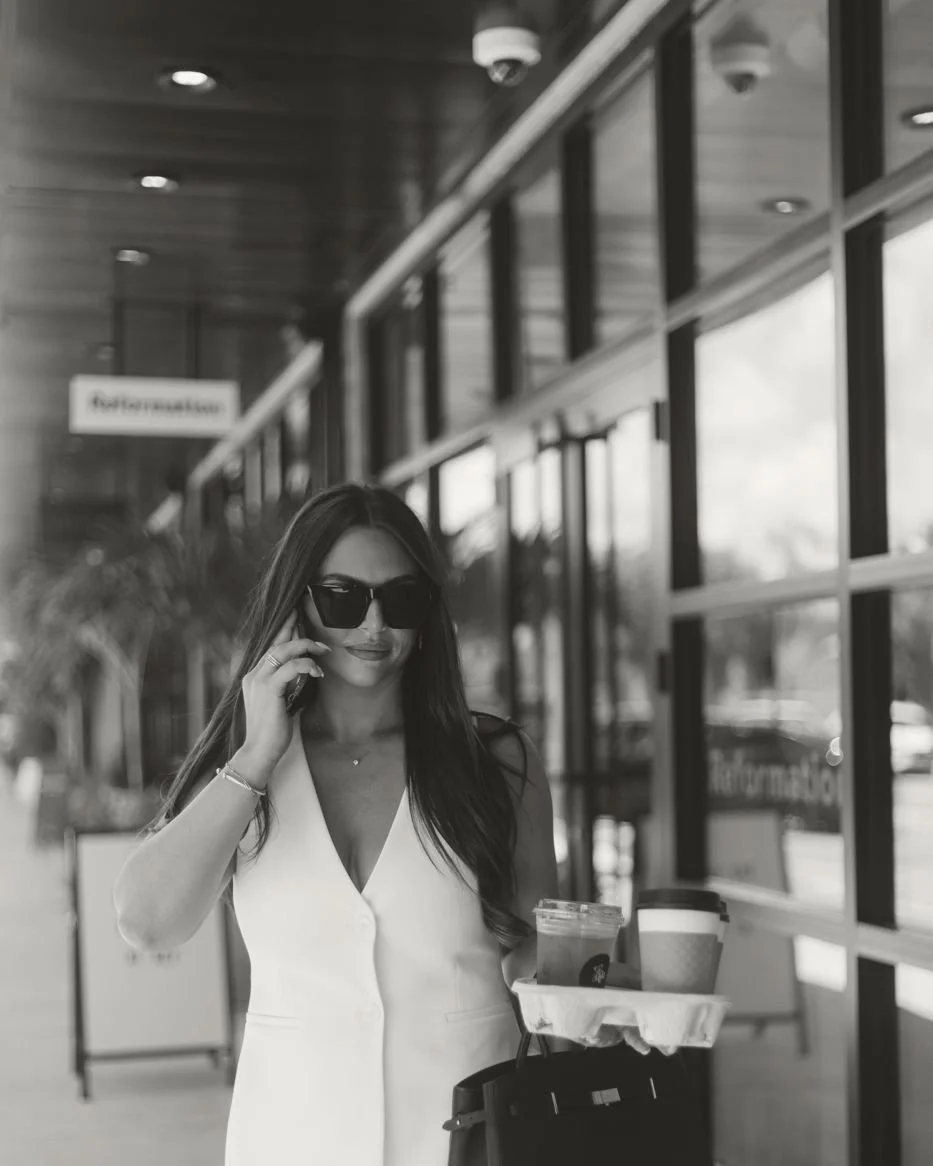 Nicole Marcus, founder of MARCETING HOUSE, on a phone call outside