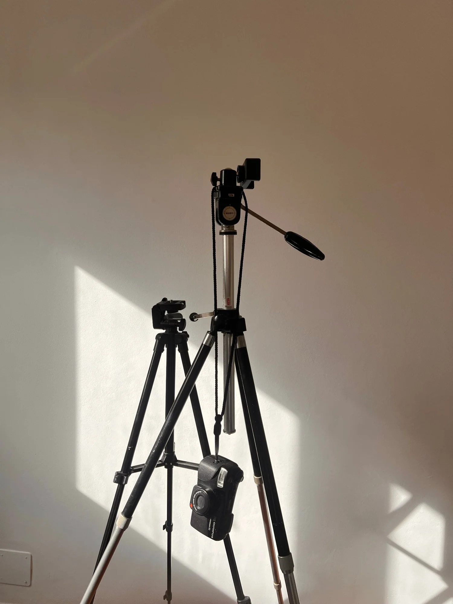 A tripod set up in an empty room
