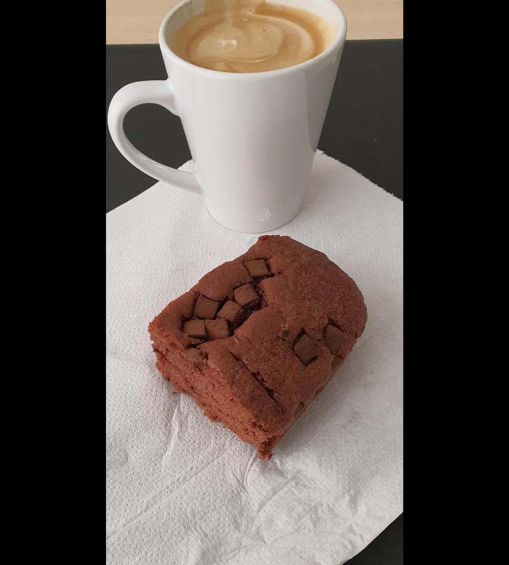 A coffee and a chocolate brownie