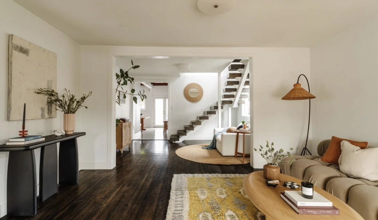 Open living room with staircase and hardwood floors