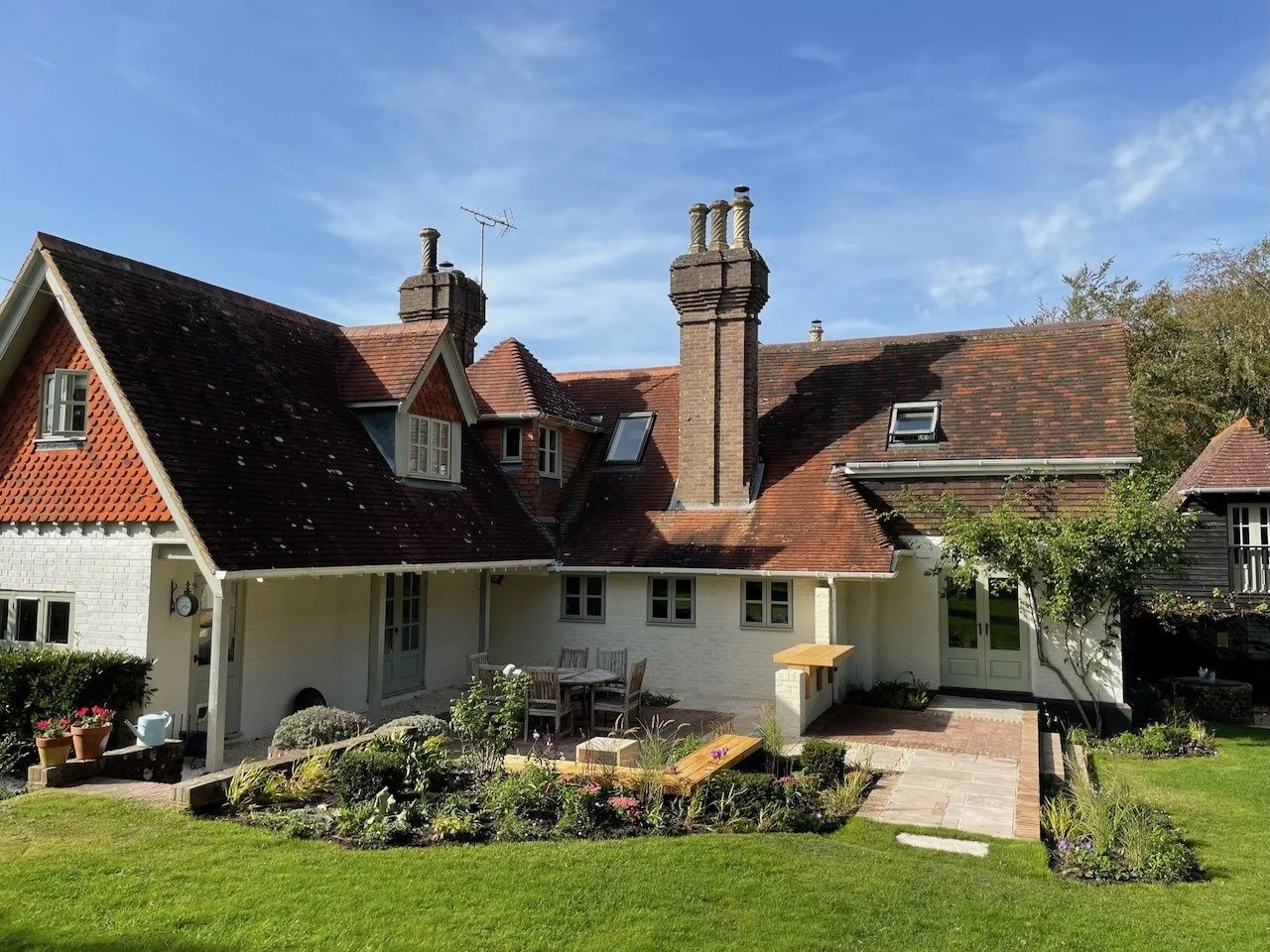 Country house and planted garden terrace at South Lodge.