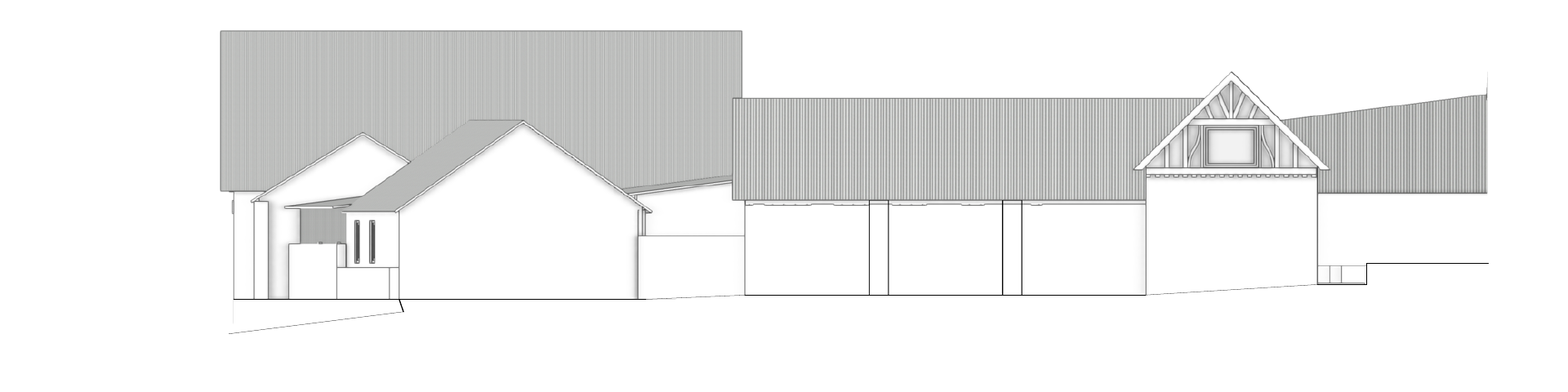 Existing east elevation, including later structures that obscure the older farm buildings.