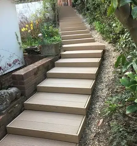 Completed composite-clad steps at South View, climbing the planted hillside.
