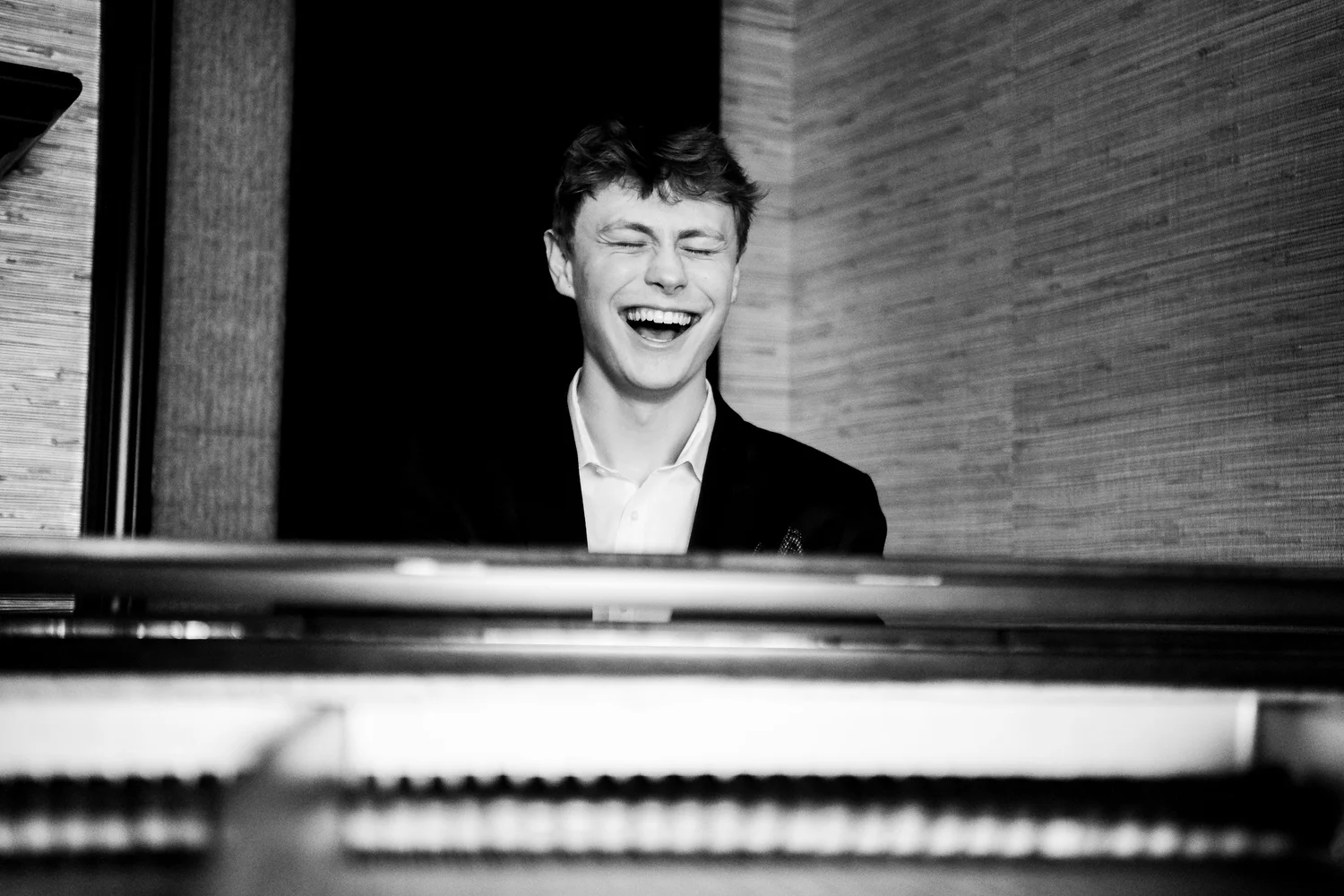 Nash Ohlund laughing at the piano