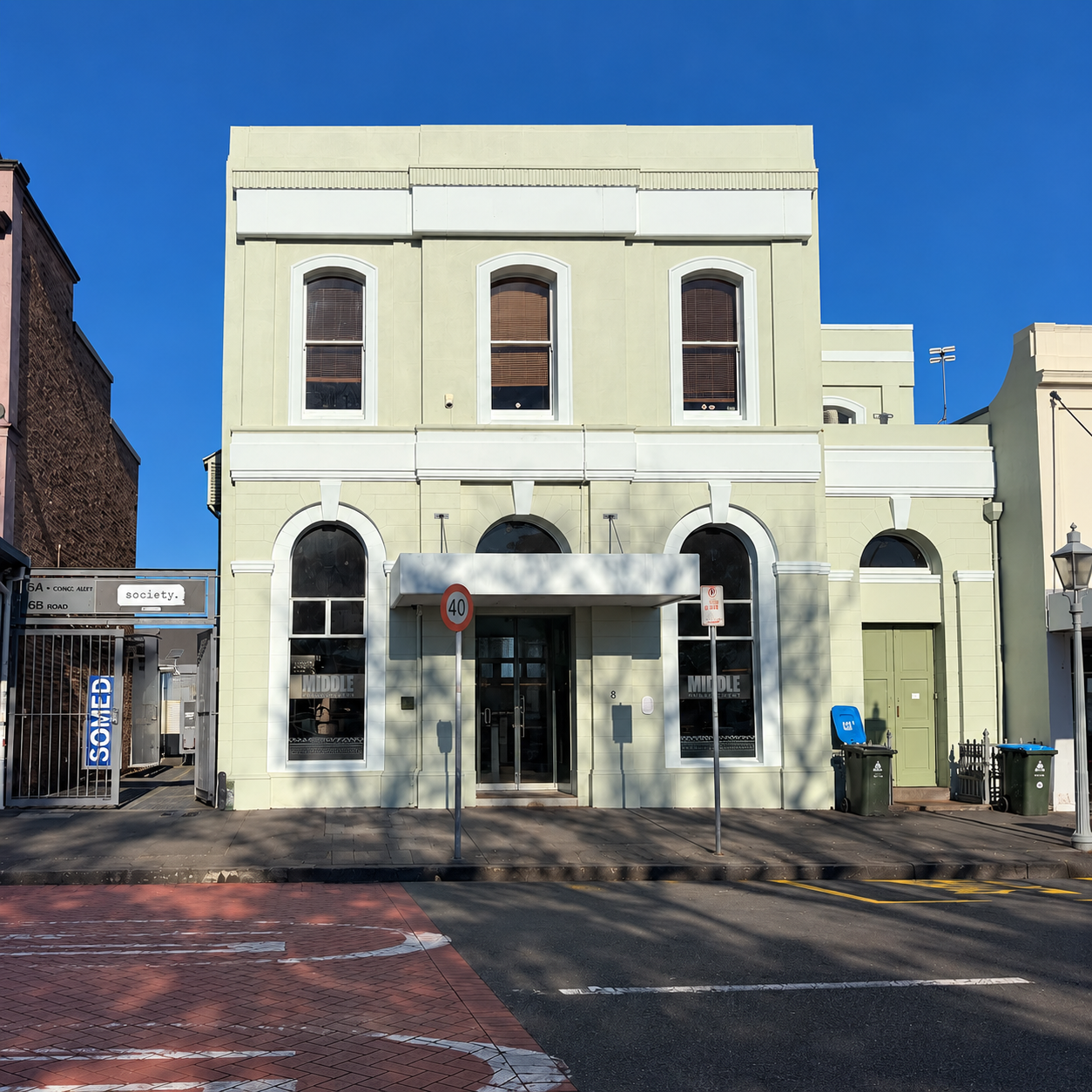 Pale green commercial building exterior
