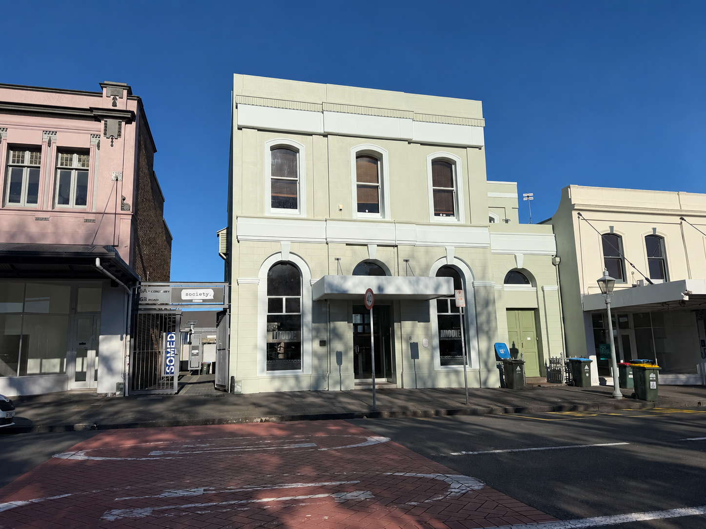 Pale green commercial building exterior