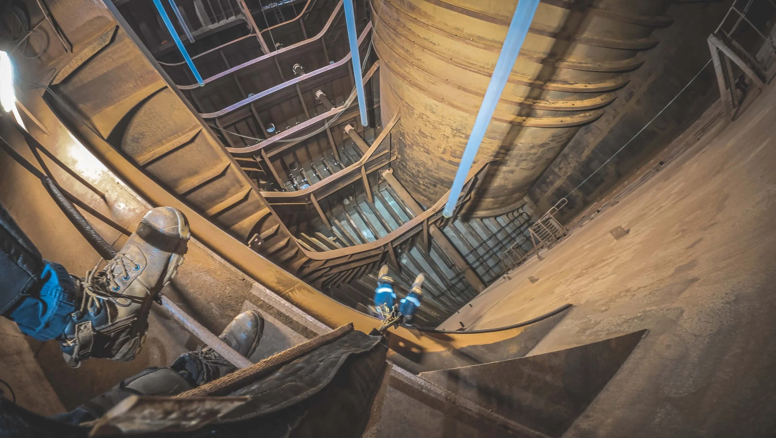 Technicians working inside a large industrial confined space