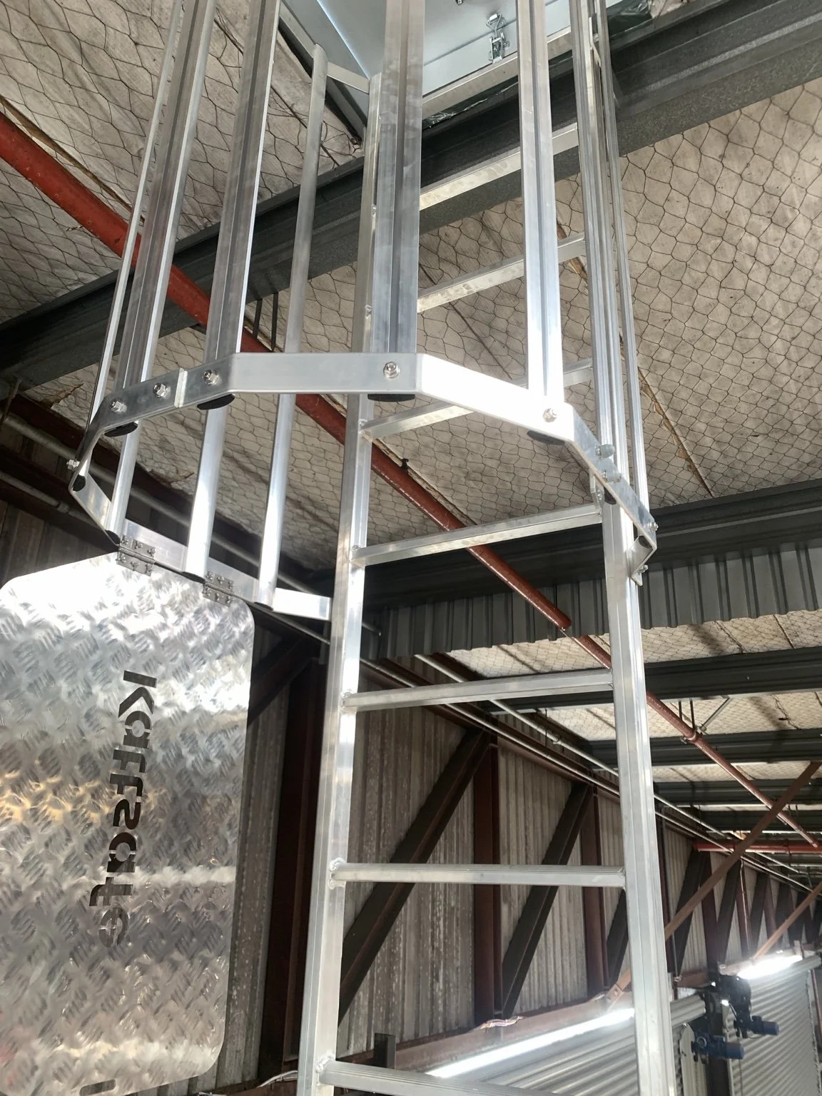 Fixed ladder and access structure inside a commercial building
