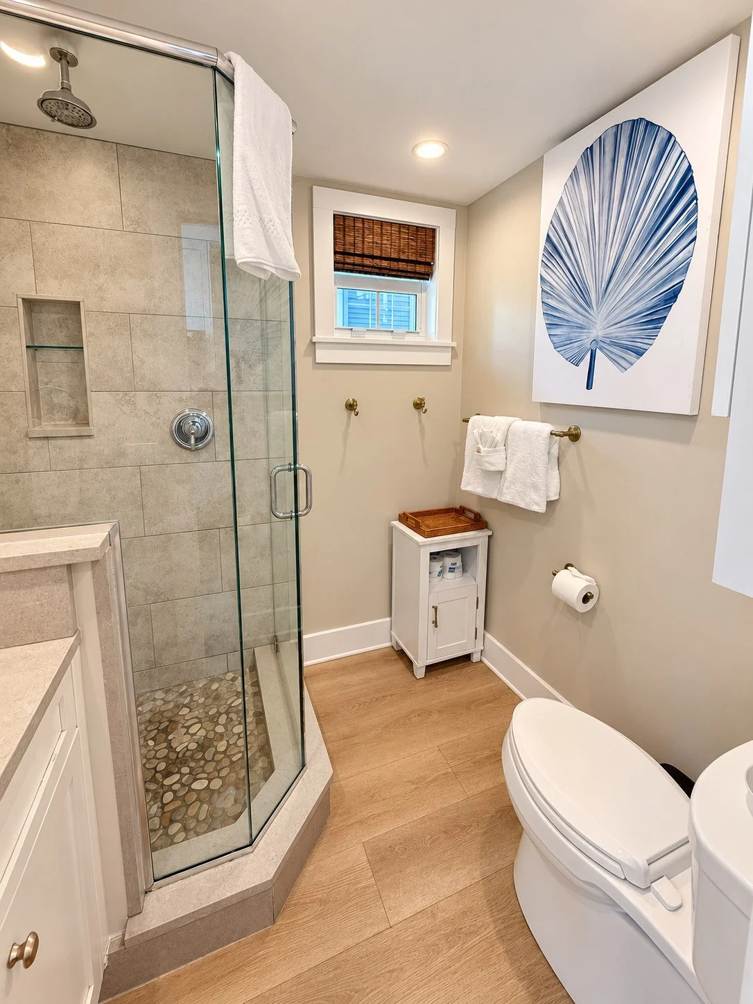 Glass walk-in shower and coastal bathroom at Key West Lighthouse Suite