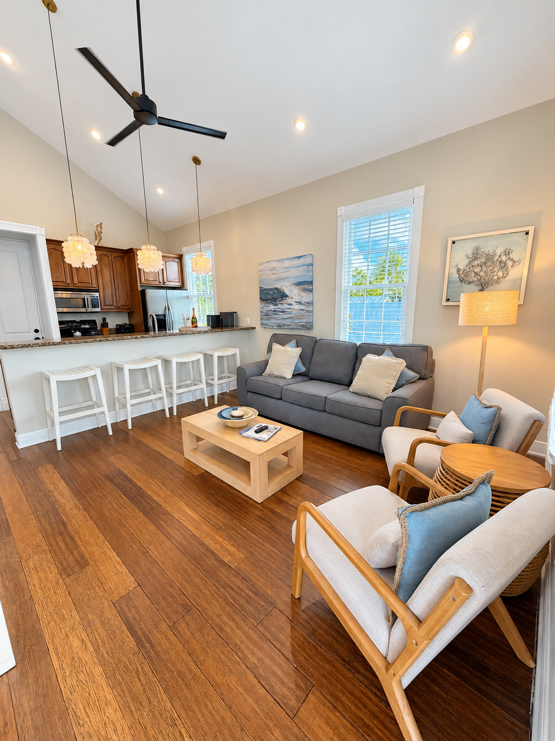 Sombrero Reef seating area with gray sofa, two armchairs and a wood coffee table