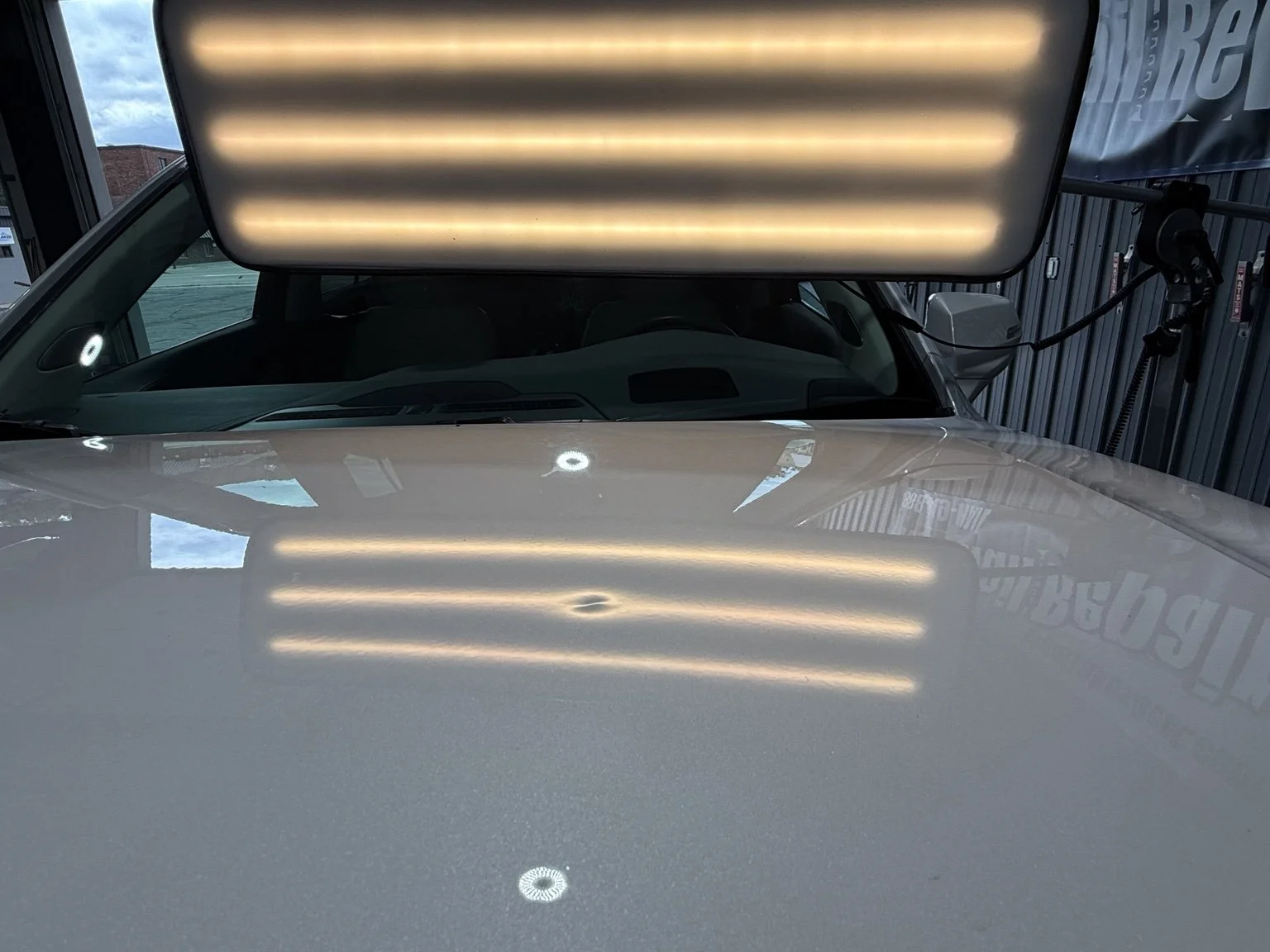 White hood before paintless dent repair