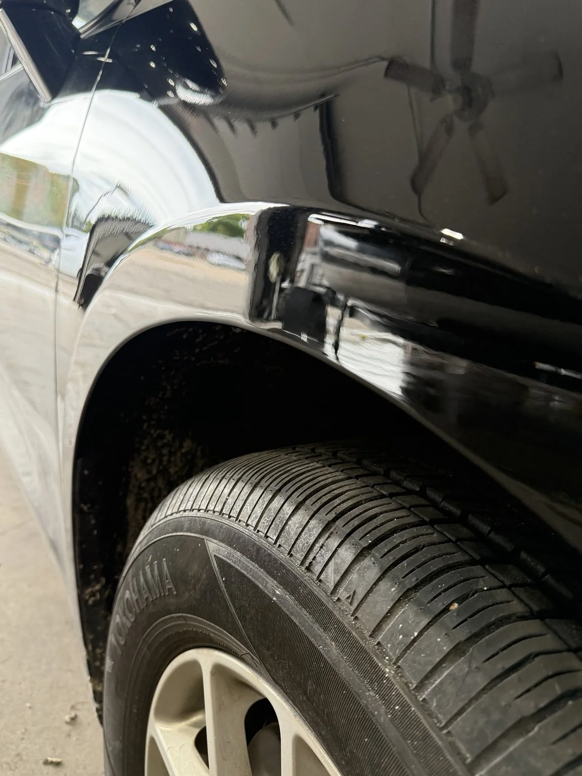 Black fender after paintless dent repair