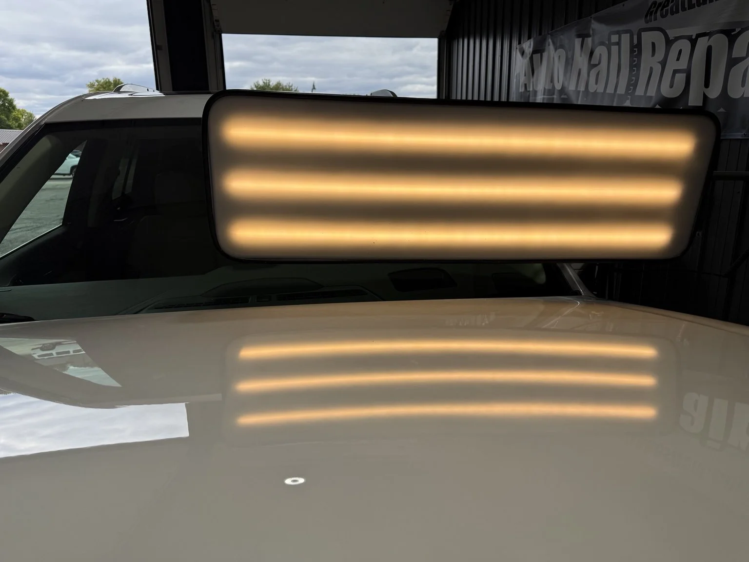 White hood after paintless dent repair