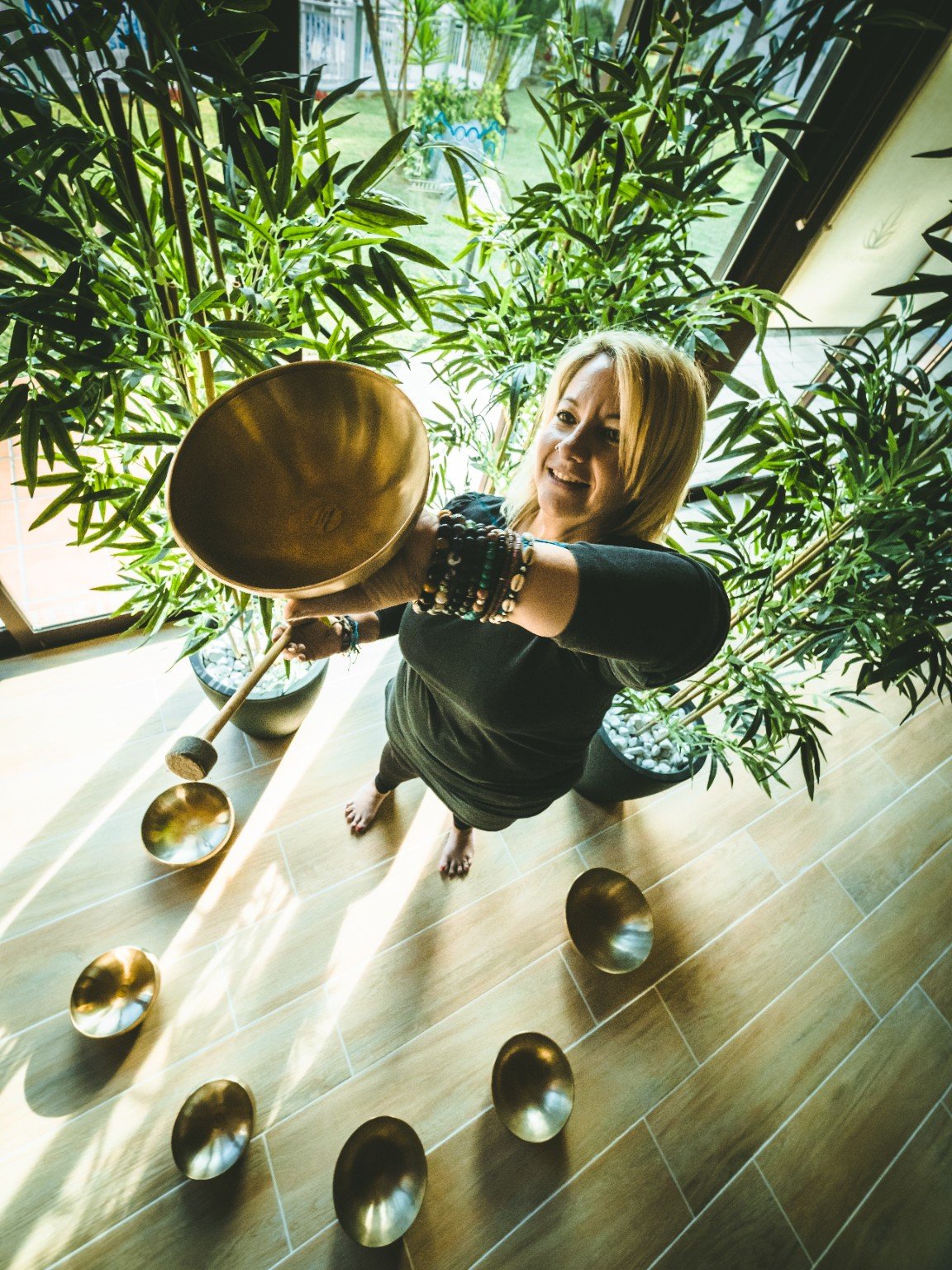 Franita working with a therapeutic bowl in a light-filled space