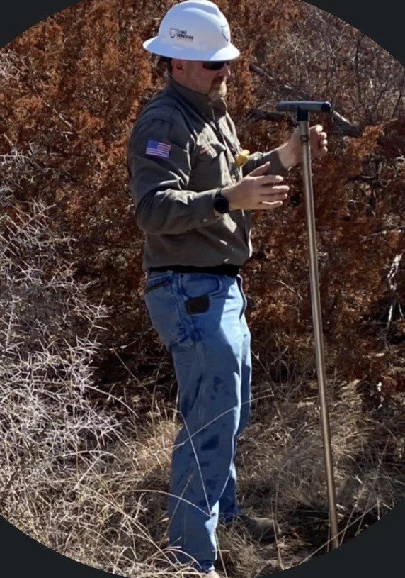 Dewayne Haverstick working outdoors with field sampling equipment