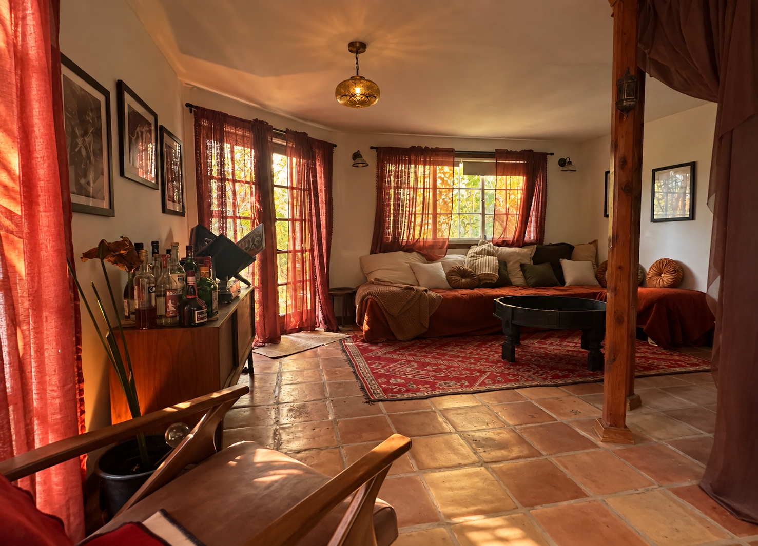 Living room after styling: warm curtains, rugs, art on the walls, plants and a styled sofa