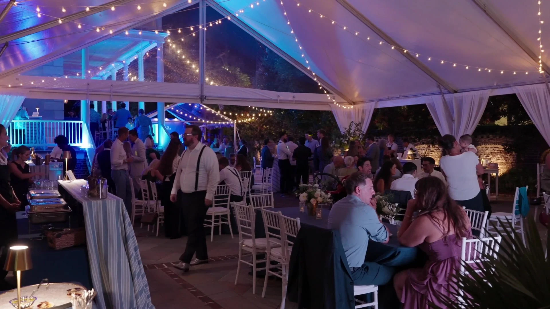 Night Two: guests in conversation beneath evening lights