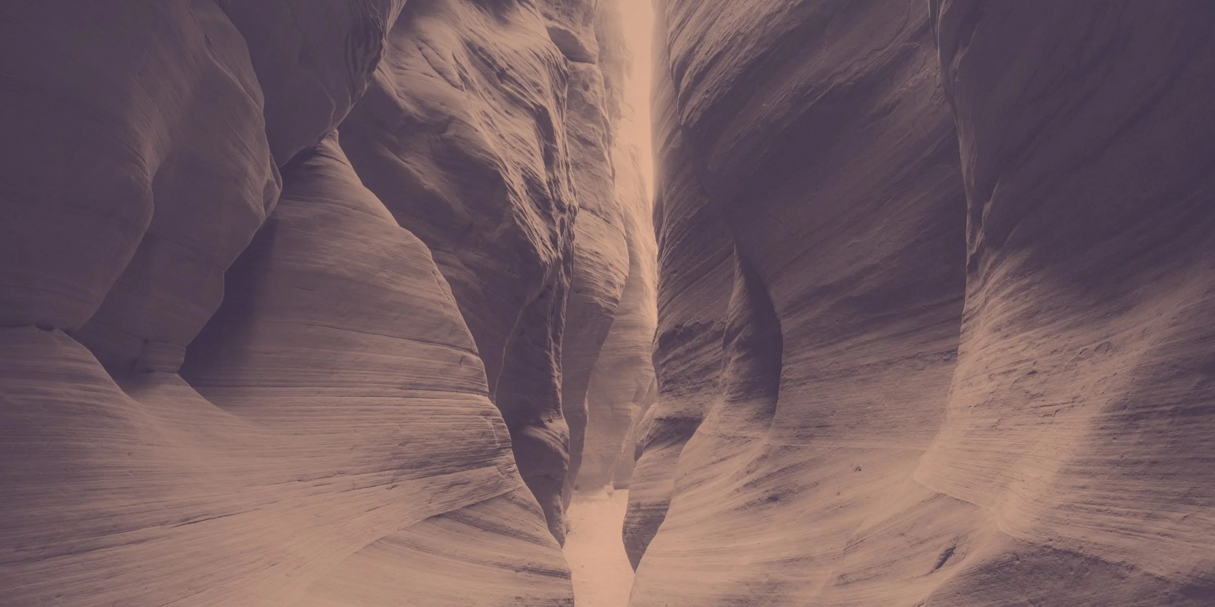 Sculpted walls of a red rock slot canyon