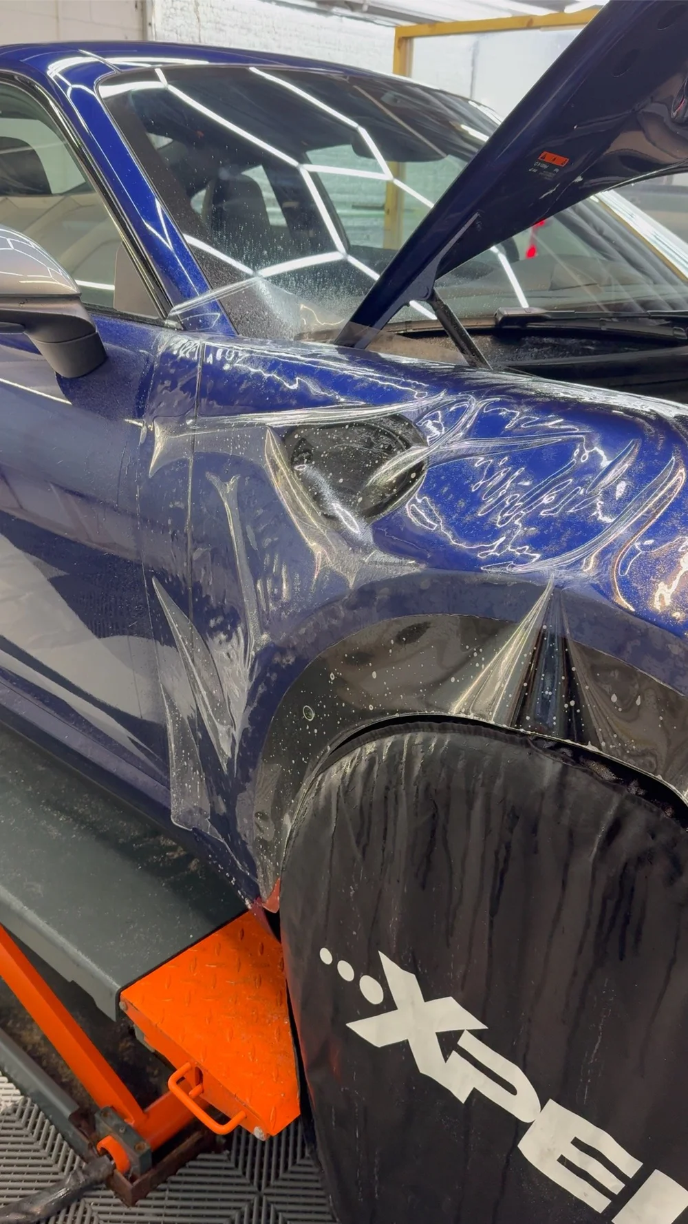 PPF fender install in progress on a Porsche 911 at OCD Tinting & Wraps, Fort Walton Beach
