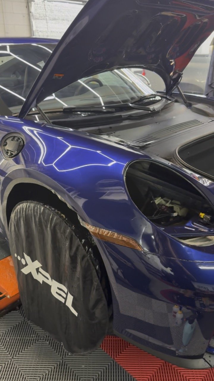 Hood paint protection film install on a Porsche 911 at OCD Tinting & Wraps, Fort Walton Beach