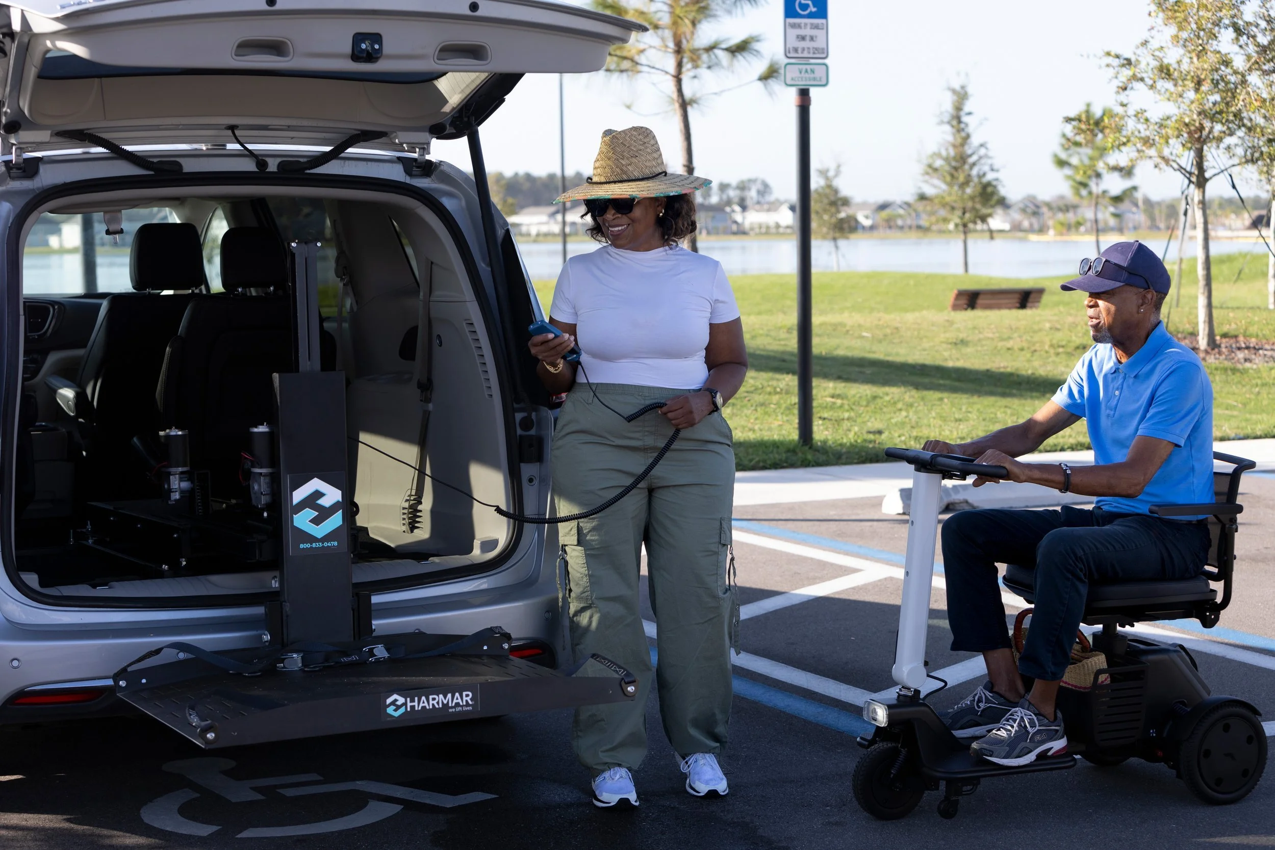 Mobility scooter secured on a vehicle lift for accessible transportation.