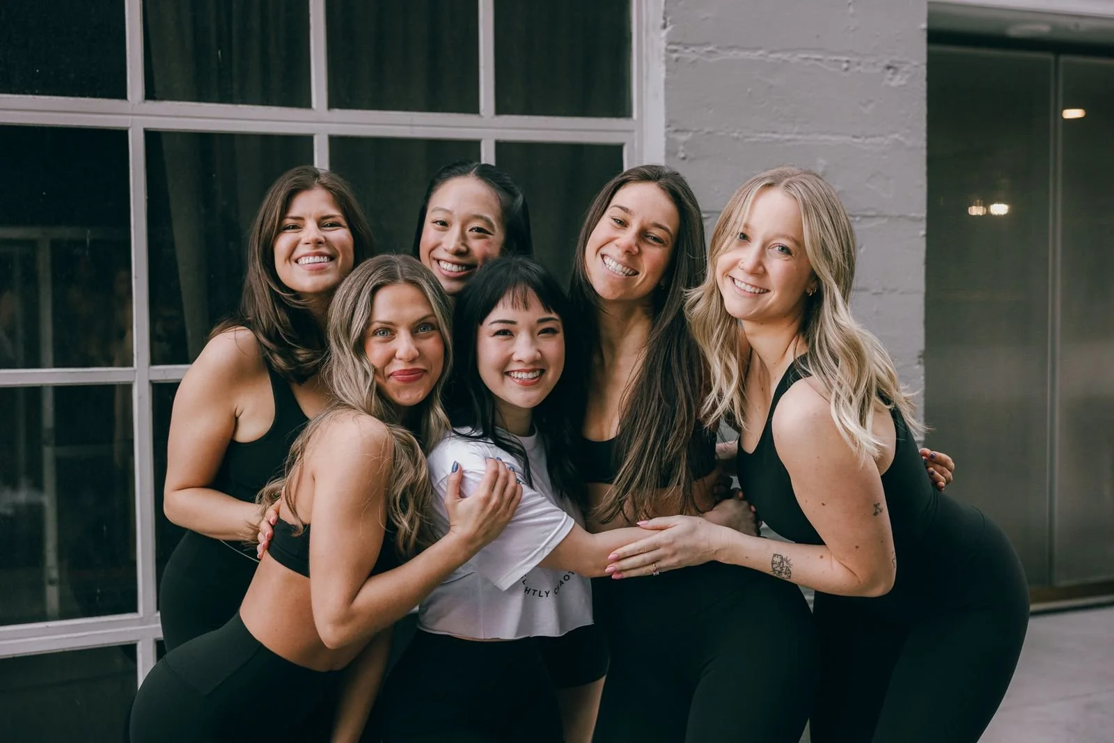 MOOV members in a group hug at South Lake Union