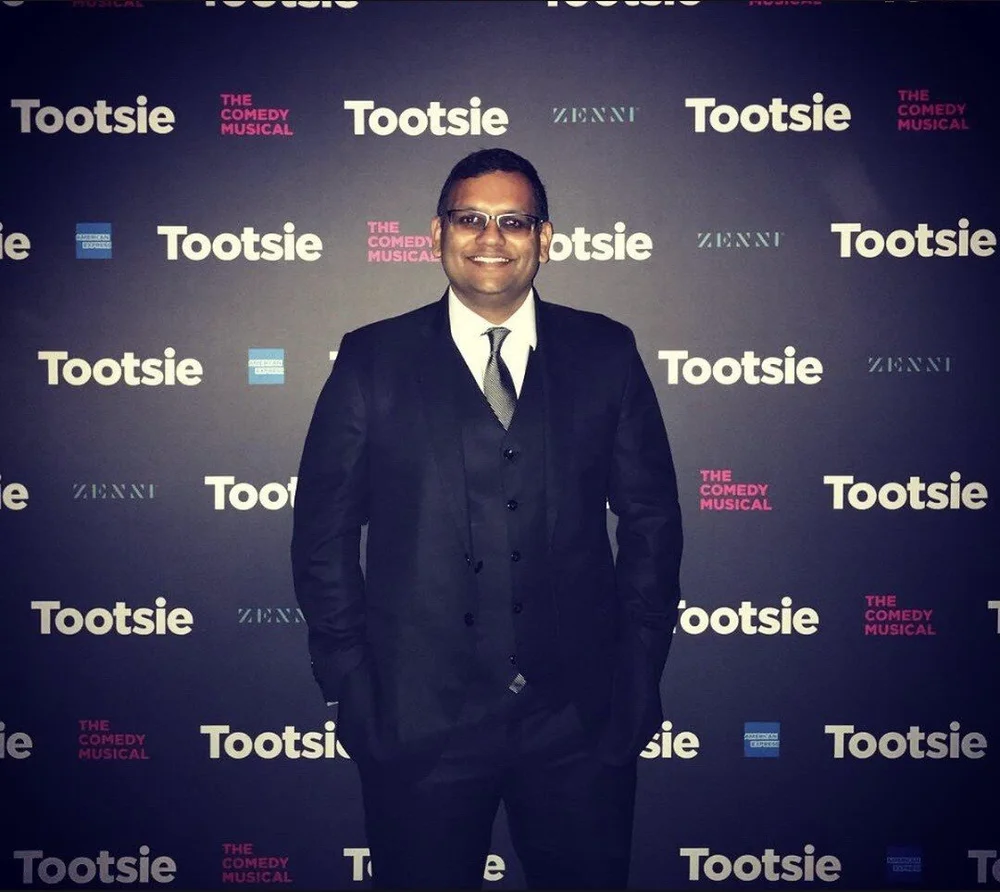 Ankit Agrawal on the opening-night red carpet in front of a Tootsie backdrop