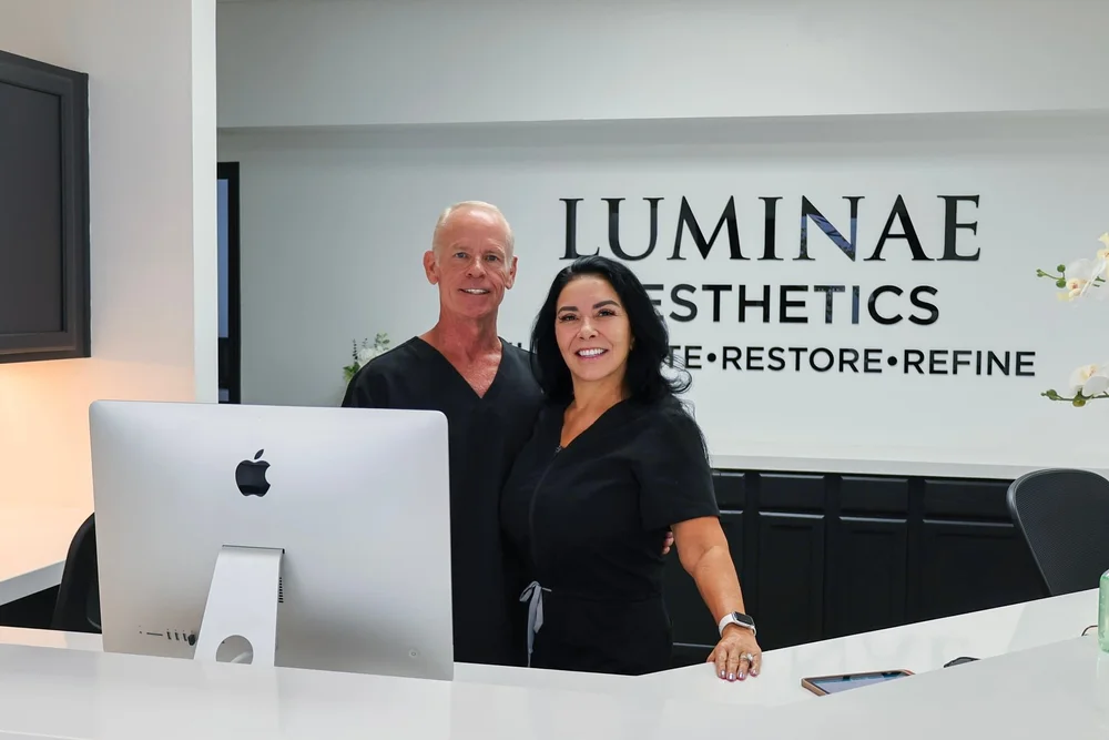 Lupe and a team member at reception