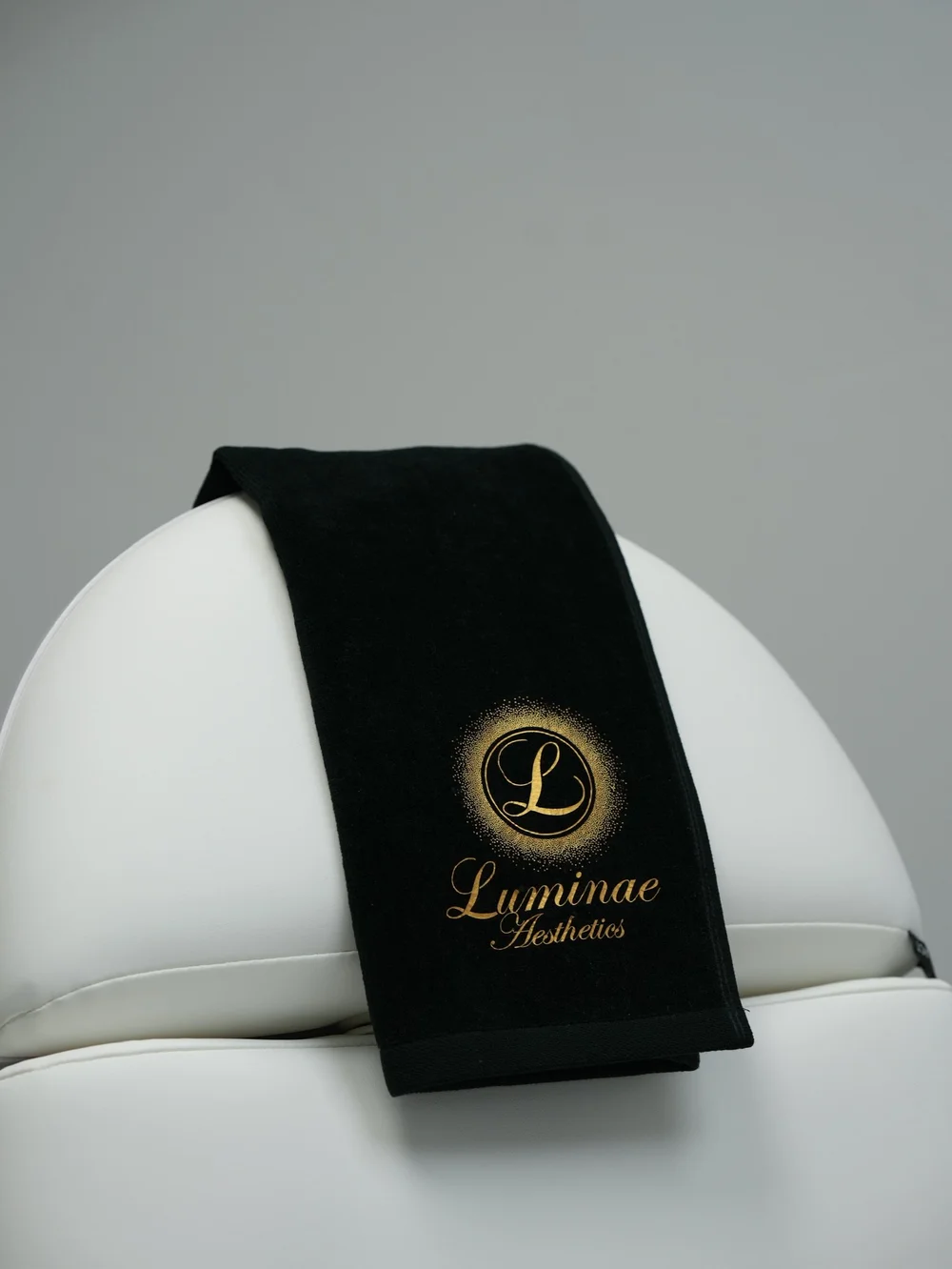 Luminae branded towel on a treatment chair