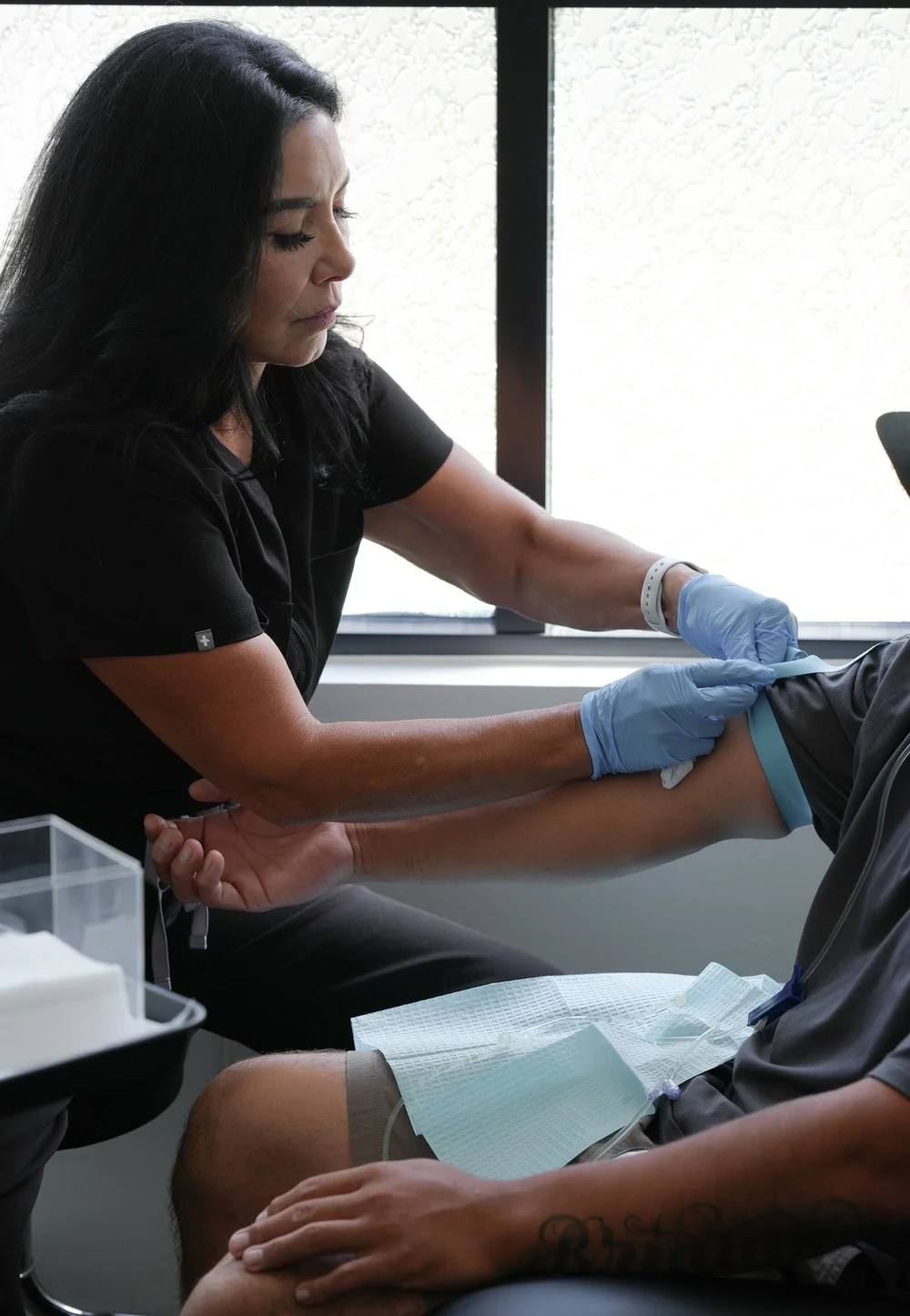 Lupe caring for a patient