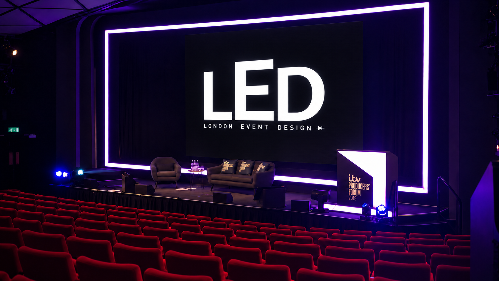 Conference stage with purple lighting and London Event Design screen