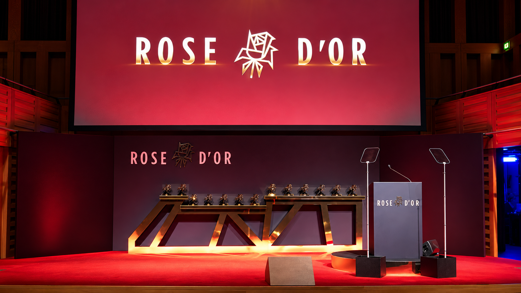 Rose d’Or awards stage with red and gold lighting