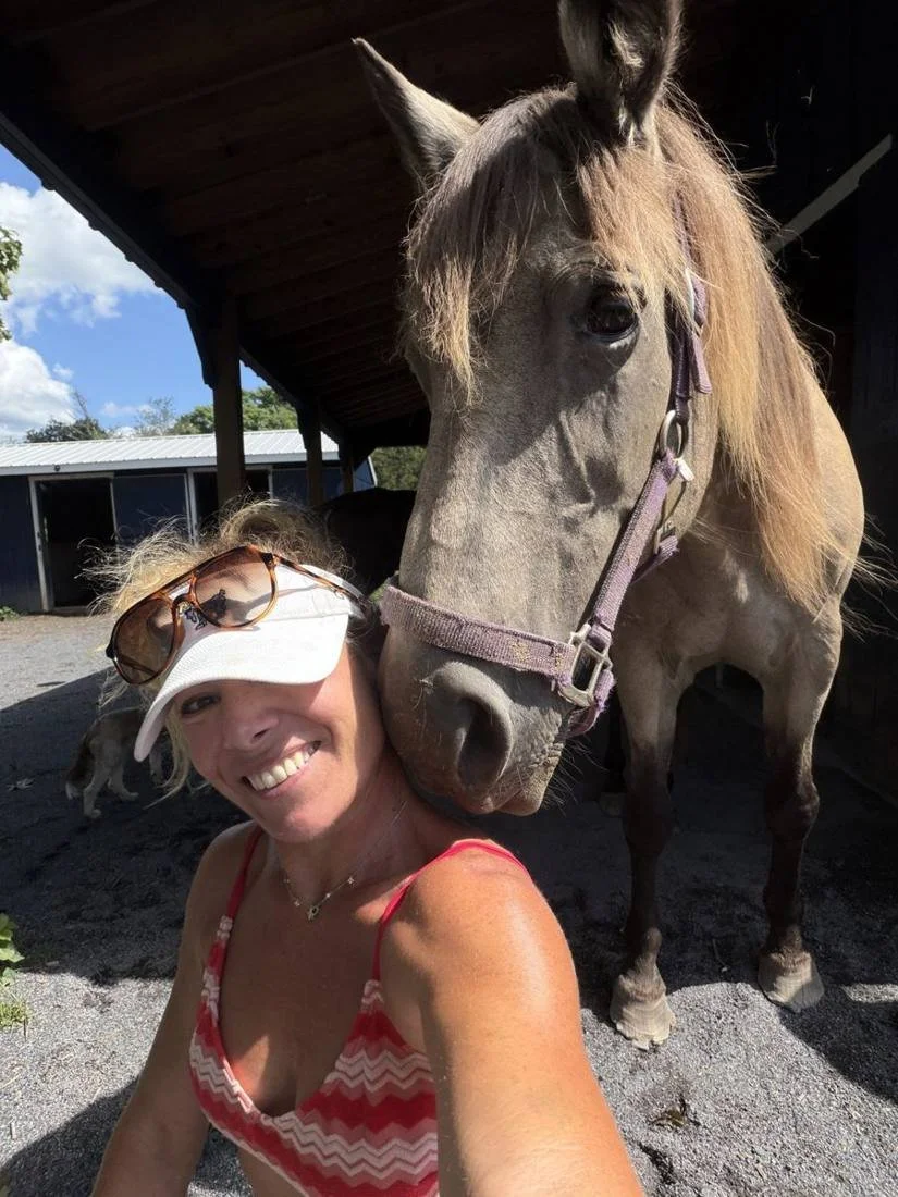Havenstone's founder cheek to cheek with a rescued horse