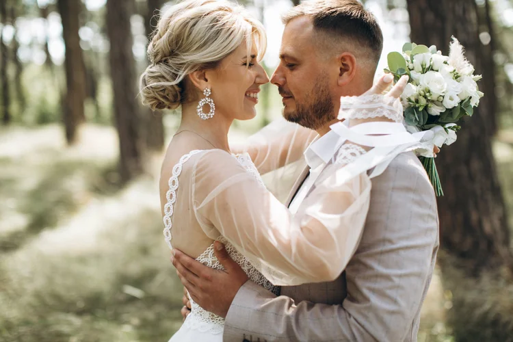 Couple embracing in a forest