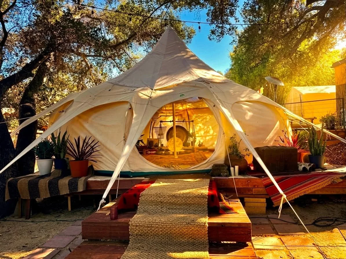 The sanctuary tent exterior at golden hour