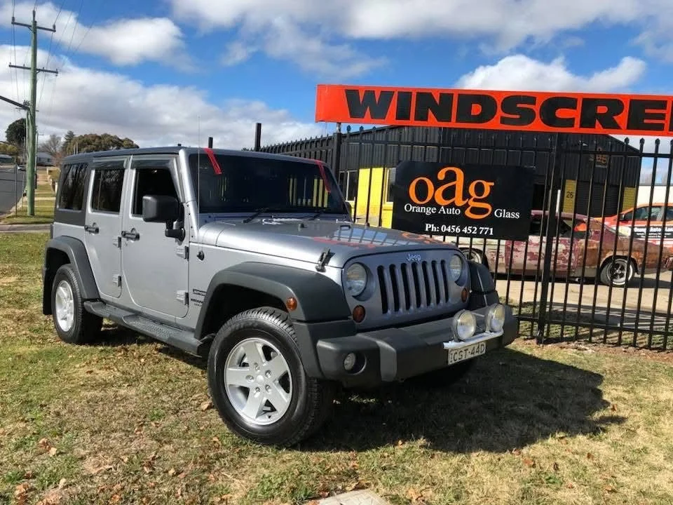 Jeep Wrangler 4WD parked outside the Orange Auto Glass workshop after a windscreen replacement